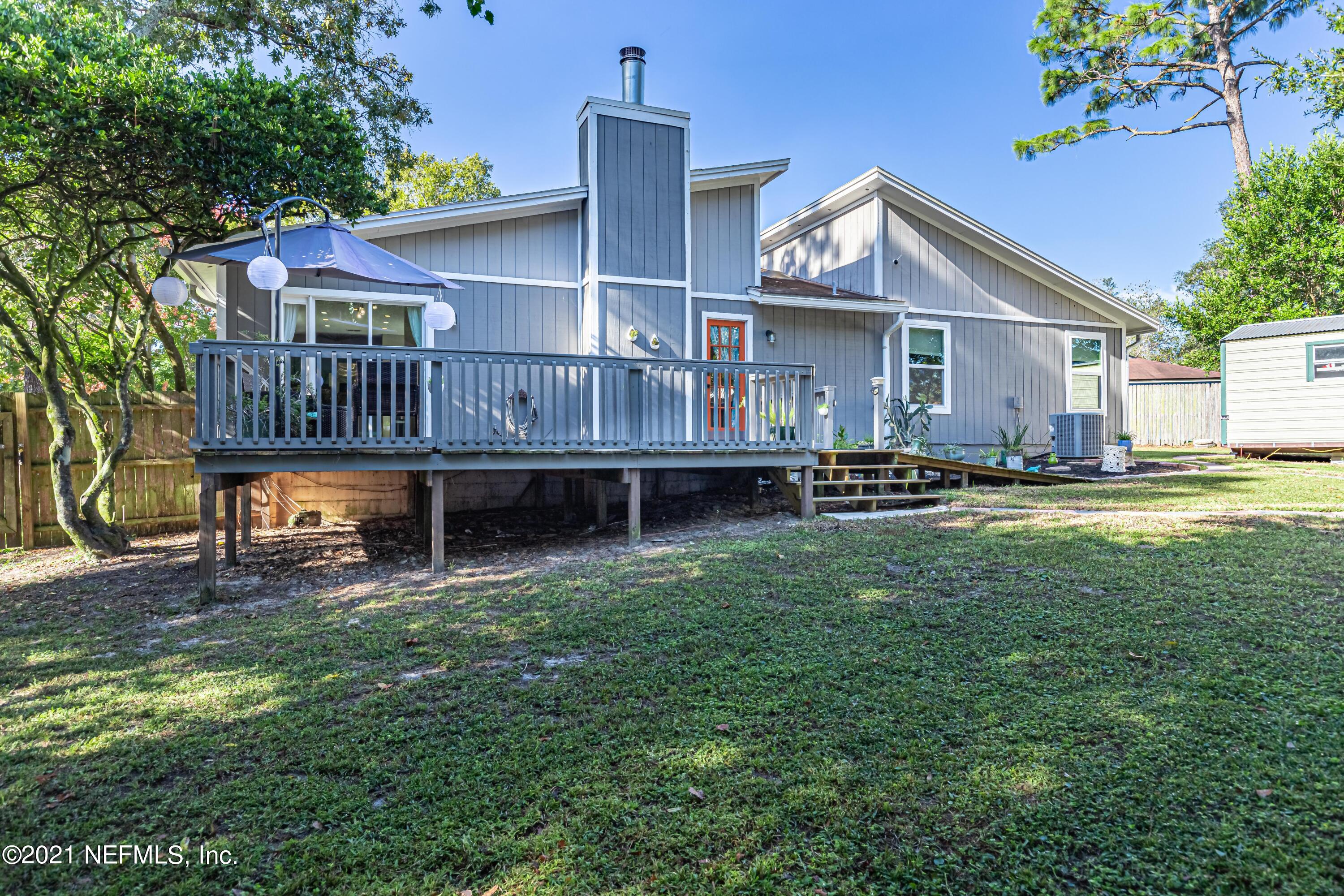 12825 Ridgemore Lane Jacksonville, FL 32258 - Photo 33 of 37 a view of a house with a yard and sitting area