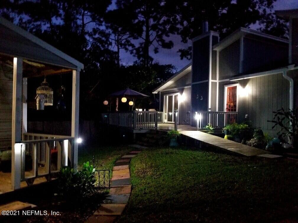 12825 Ridgemore Lane Jacksonville, FL 32258 - Photo 34 of 37 a view of a porch that has a bunch of plants and flowers