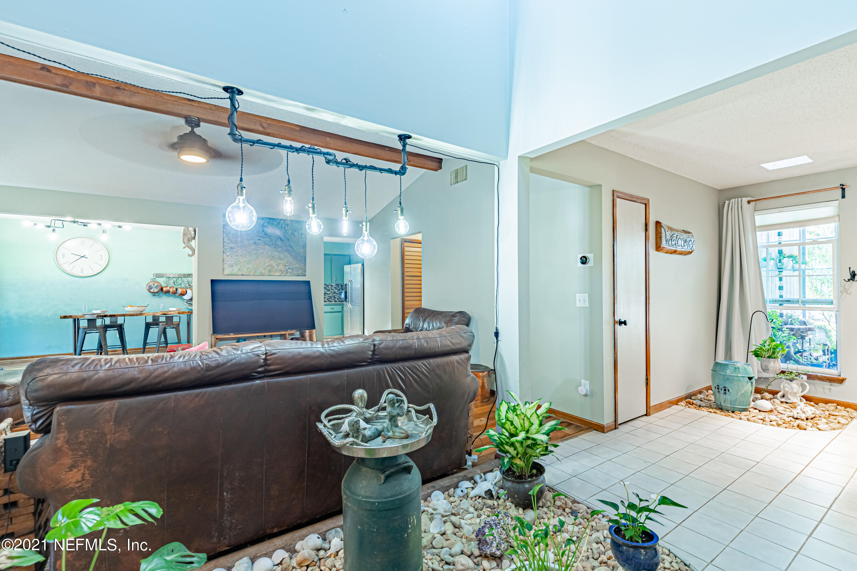 12825 Ridgemore Lane Jacksonville, FL 32258 - Photo 7 of 37 a living room with furniture and a mirror
