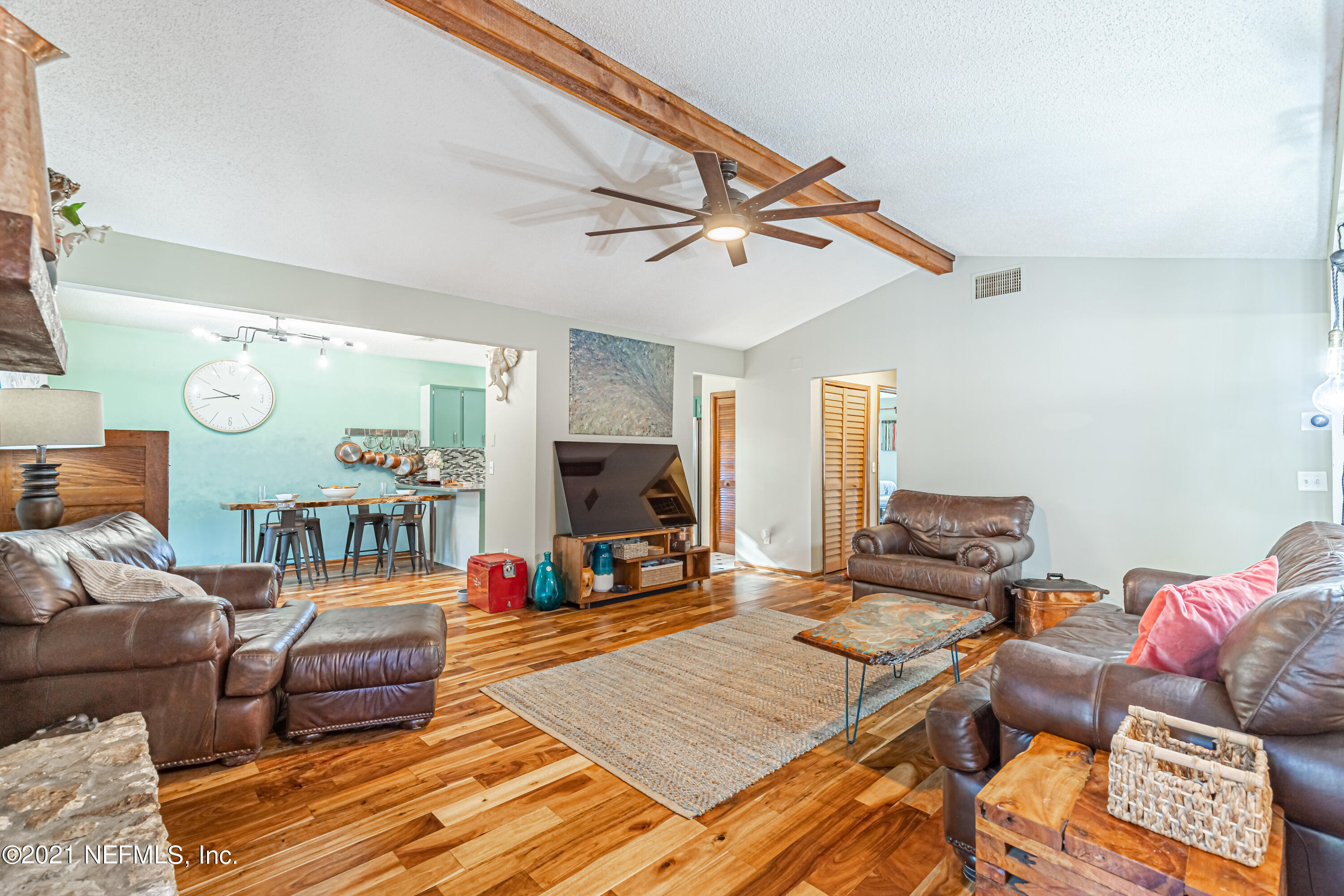 12825 Ridgemore Lane Jacksonville, FL 32258 - Photo 10 of 37 a living room with furniture and a flat screen tv