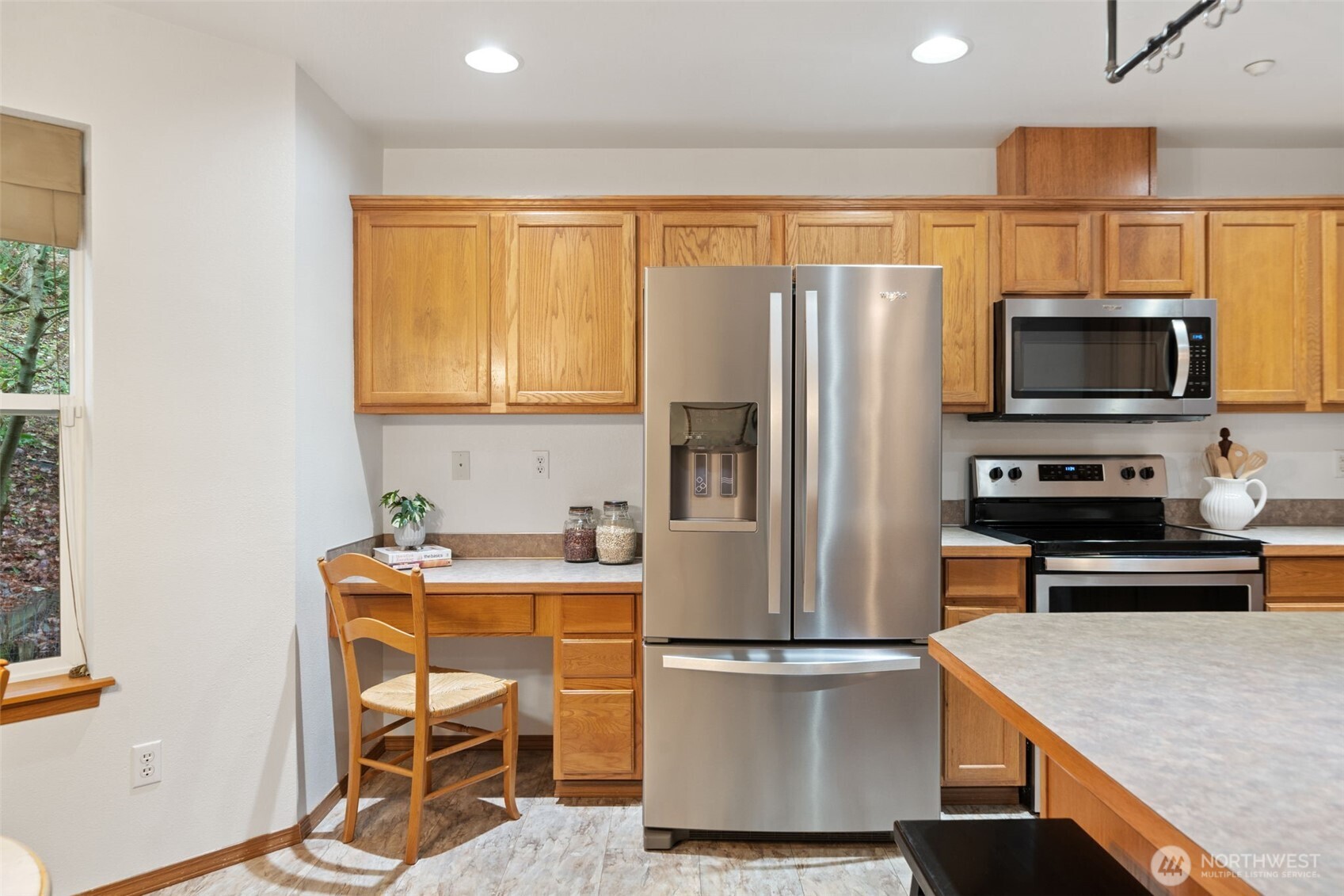 514 Southwest Hipkins Court Port Orchard, WA 98367 - Photo 16 of 39 a kitchen with a refrigerator a stove a sink and a microwave
