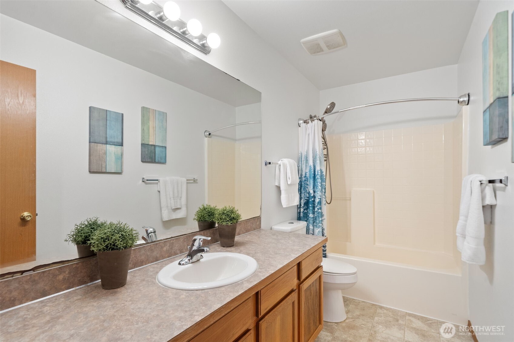 514 Southwest Hipkins Court Port Orchard, WA 98367 - Photo 36 of 39 a bathroom with a granite countertop sink toilet and shower