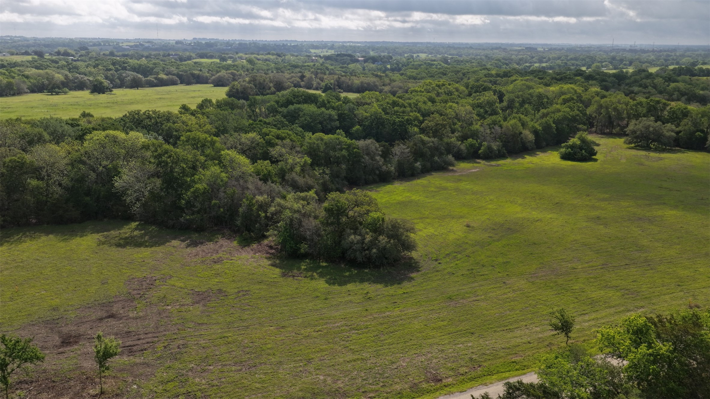 2 Baranowski Road Brenham, TX 77833 - Photo 4 of 7 a view of a lake with a yard