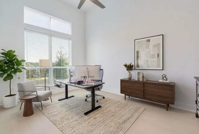 a bathroom with a tub a sink and a mirror