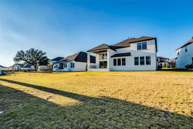 a bathroom with a granite countertop toilet sink and mirror