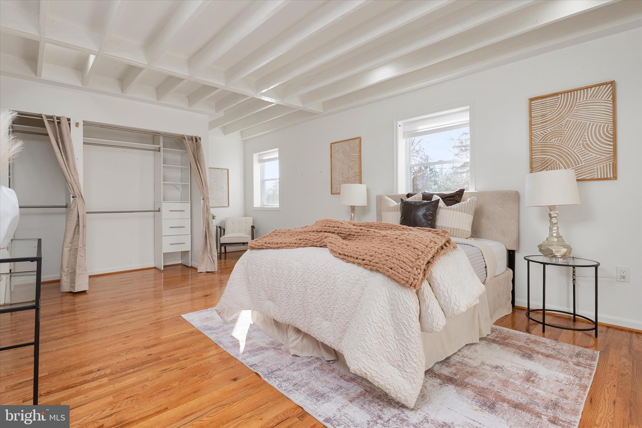 2100 Hermitage Avenue Silver Spring, MD 20902 - Photo 14 of 39 a spacious bedroom with a bed and a table
