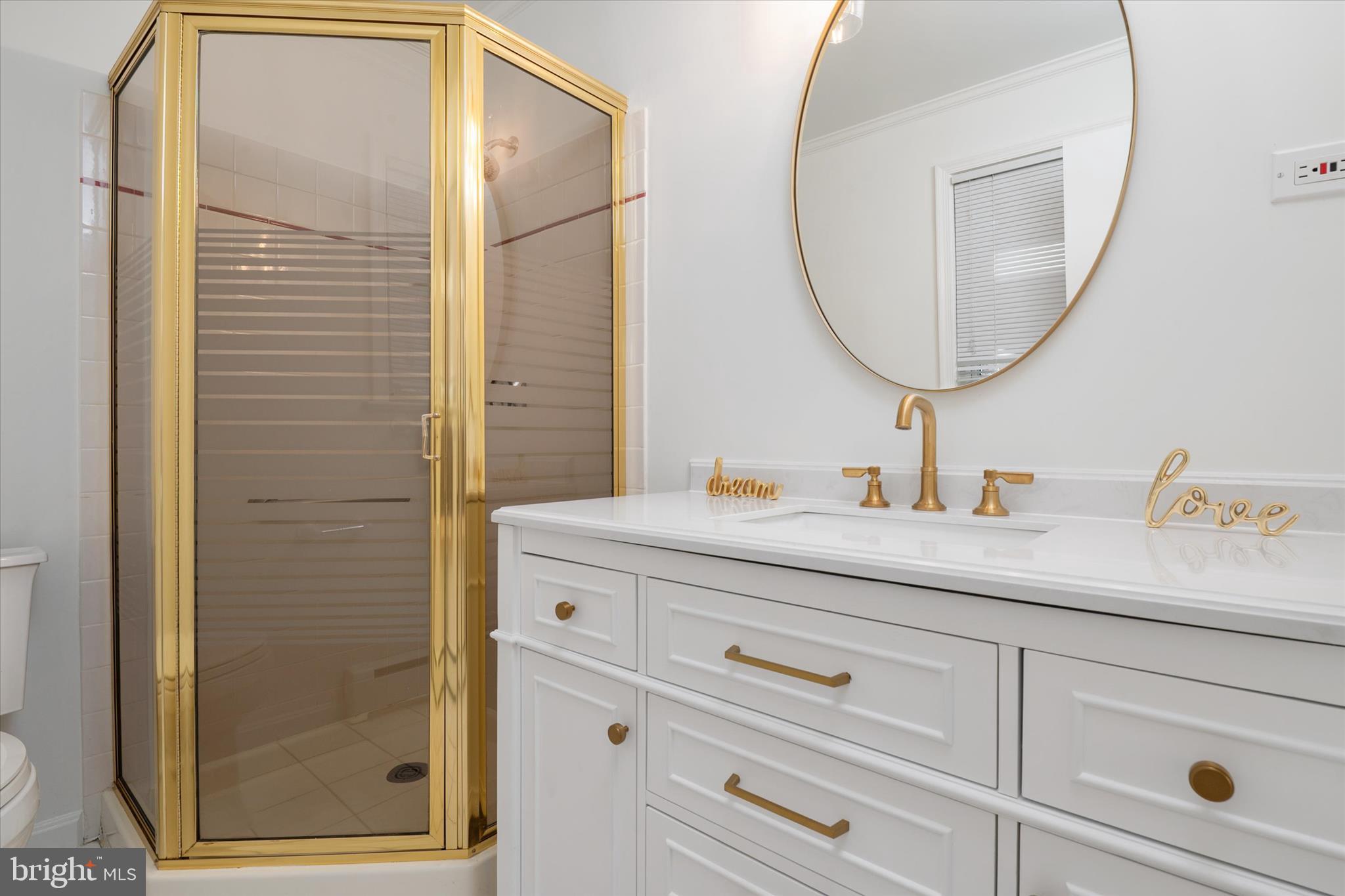 2100 Hermitage Avenue Silver Spring, MD 20902 - Photo 17 of 39 a bathroom with a sink vanity granite and a mirror
