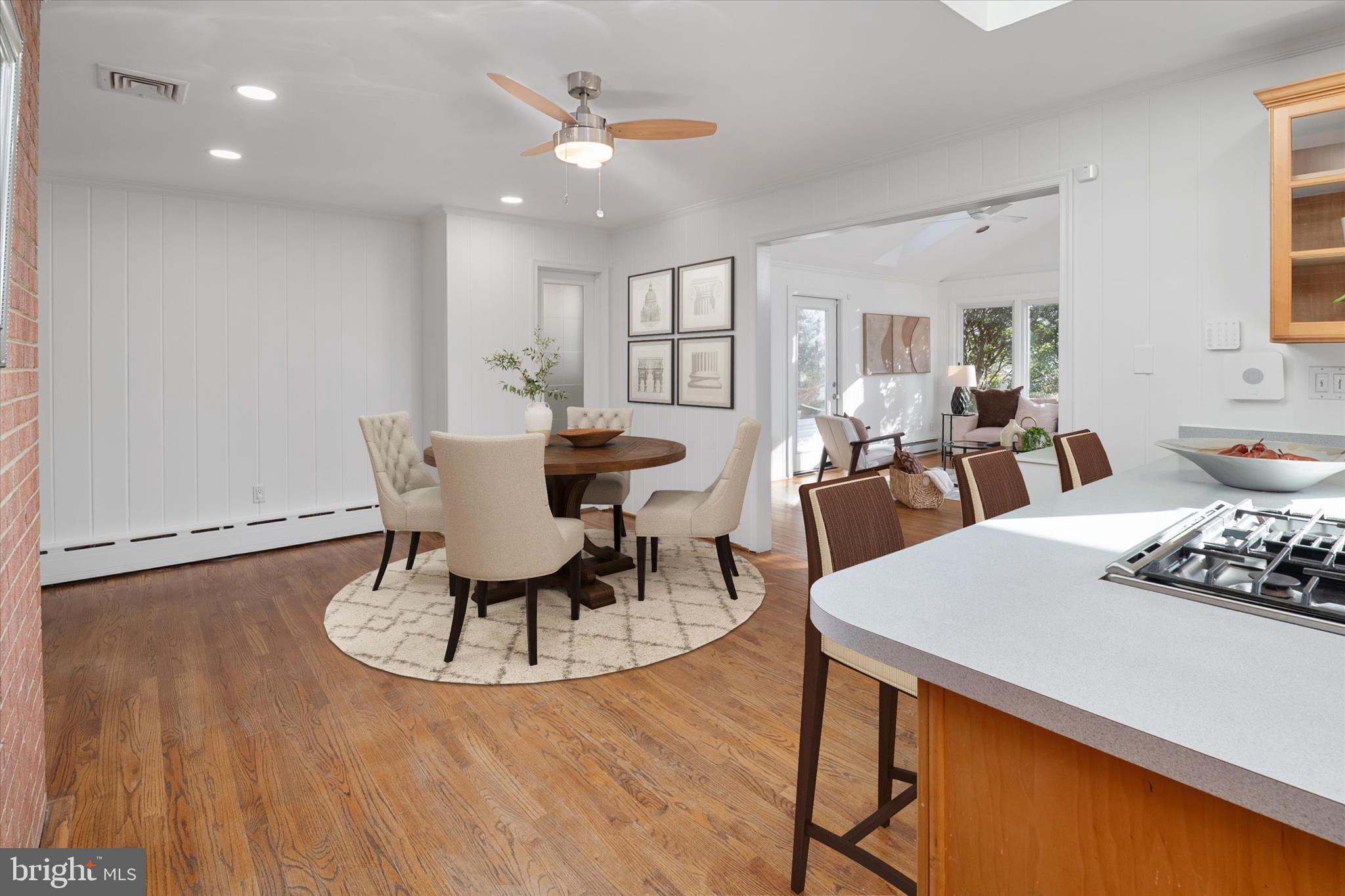 2100 Hermitage Avenue Silver Spring, MD 20902 - Photo 10 of 39 a view of a dining room with furniture a chandelier and wooden floor