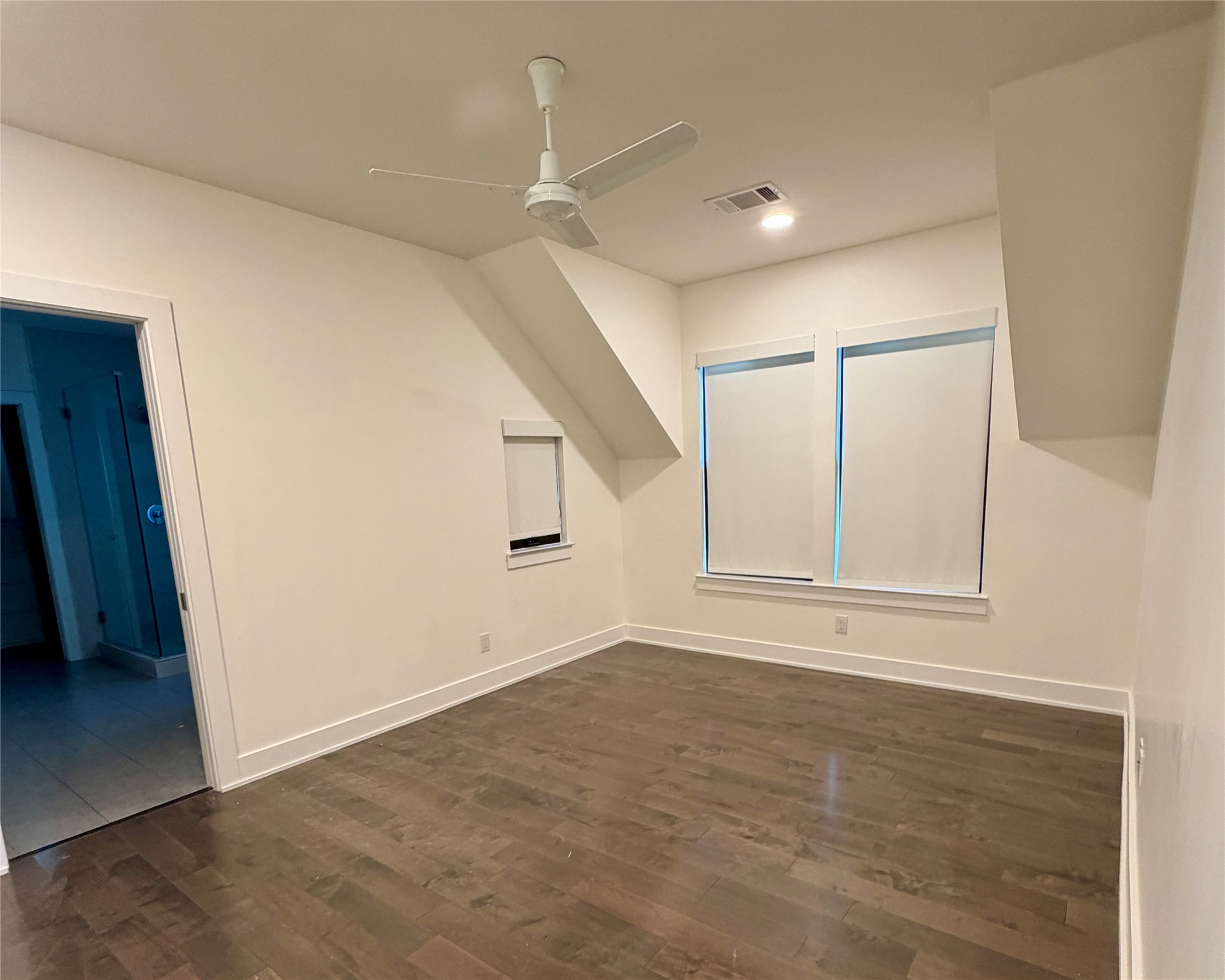 1515 Hether Street, Unit B Austin, TX 78704 - Photo 24 of 30 Hardwood floors and a pristine white palette elevate this tranquil sleeping space.