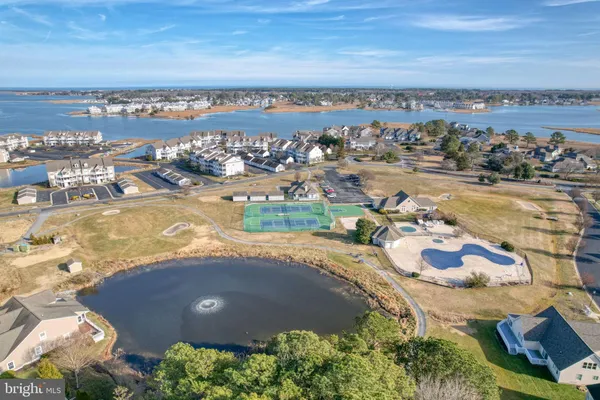 swimming pool view with a sitting space