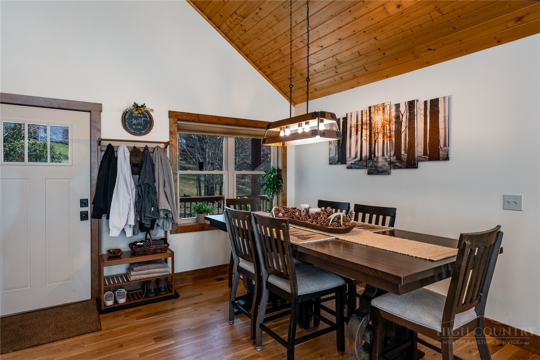 1161 Grandview Dr Extension Boone, NC 28607 - Photo 12 of 43 a view of a dining room with furniture wooden floor and chandelier