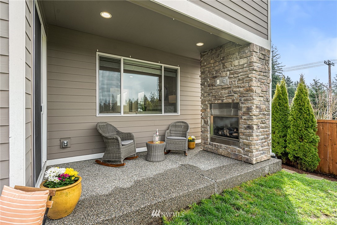 22726 36th Drive Southeast Bothell, WA 98021 - Photo 33 of 39 a outdoor living space with furniture and a fireplace