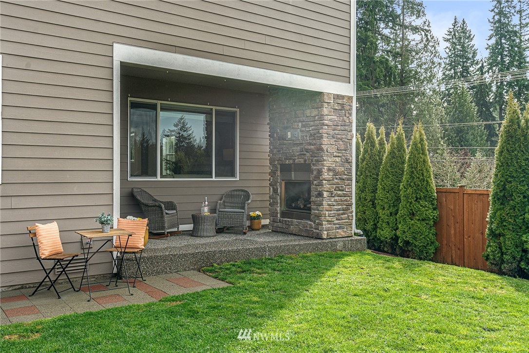22726 36th Drive Southeast Bothell, WA 98021 - Photo 36 of 39 a view of a house with backyard sitting area and garden
