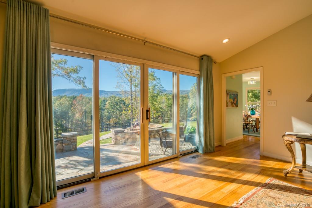 116 Fallen Tree Lane Mill Spring, NC 28756 - Photo 22 of 38 a view of a room with wooden floor and windows