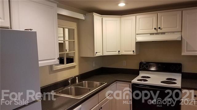385 James Street Clyde, NC 28721 - Photo 2 of 14 a kitchen with a stove and a sink