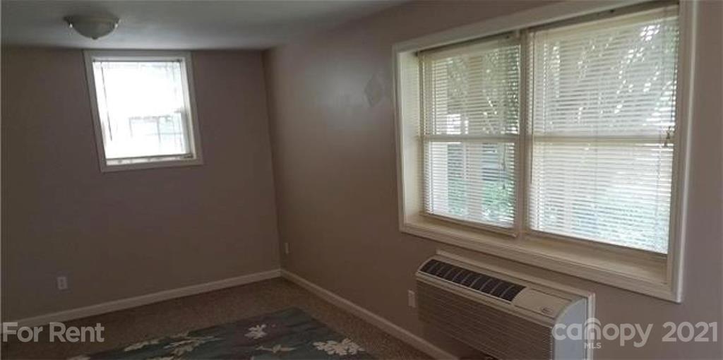 385 James Street Clyde, NC 28721 - Photo 5 of 14 a view of an empty room with a window