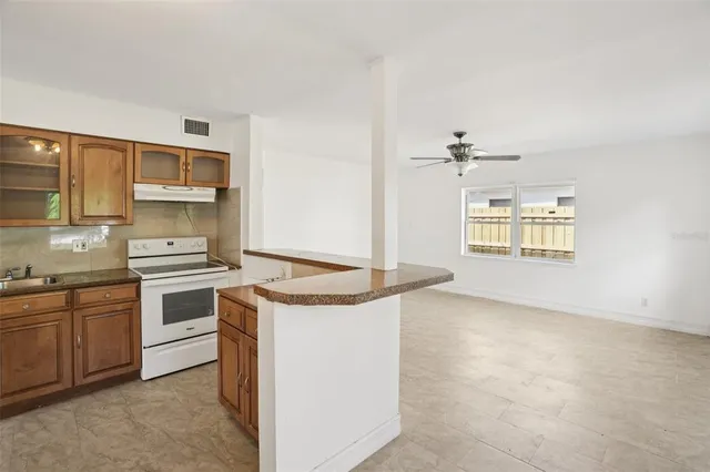 a kitchen with a stove and a sink
