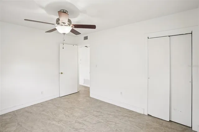 a view of a chandelier fan in a room