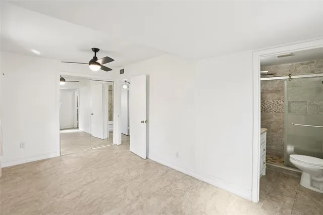 a view of a bathroom with a shower and a toilet