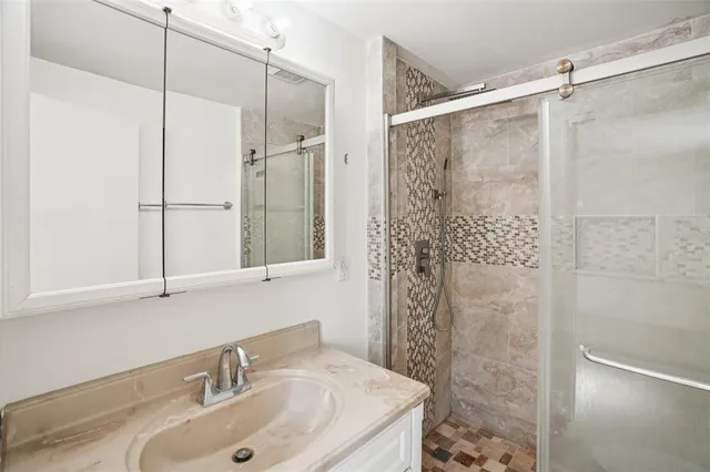 a bathroom with a sink and a mirror