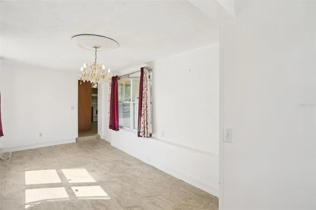 a view of a hallway with a chandelier