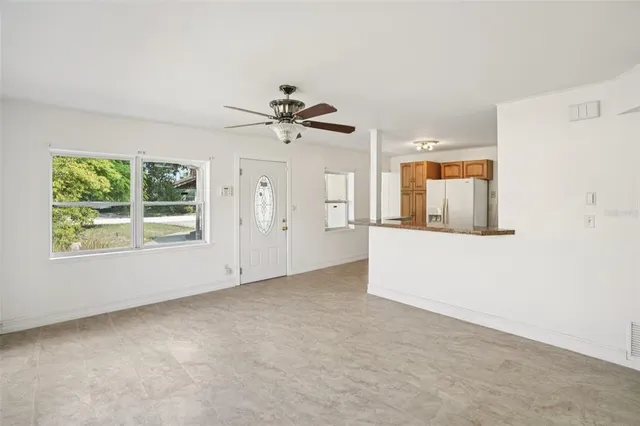 a view of an empty room with a window