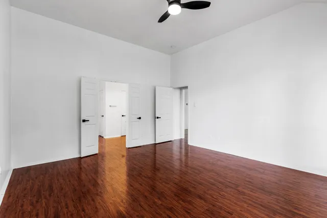 a spacious bathroom with a sink and a mirror