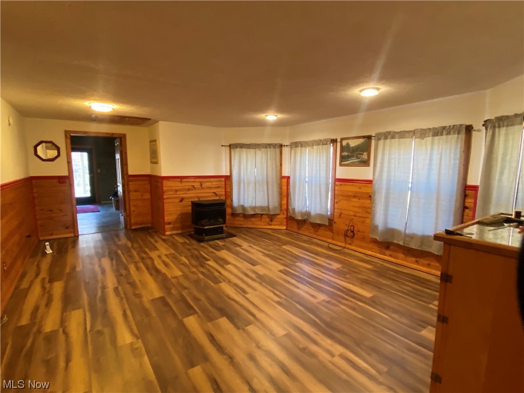 2008 Goose Creek Road Petroleum, WV 26161 - Photo 14 of 35 Unfurnished living room featuring dark hardwood / wood-style floors and a wood stove