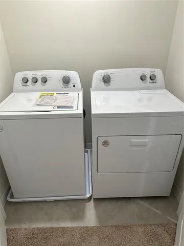 a utility room with washer and dryer