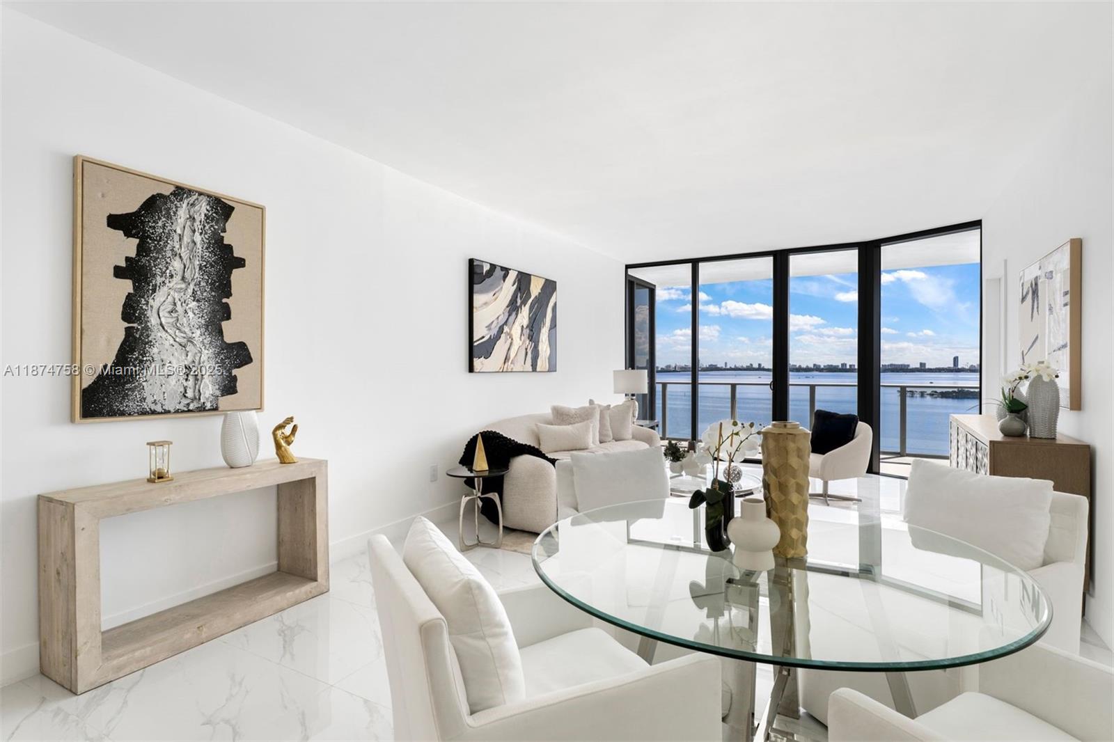 700 Northeast 24th Street, Unit 1005 Miami, FL 33137 - Photo 8 of 18 a dining room with furniture a large window and a couch