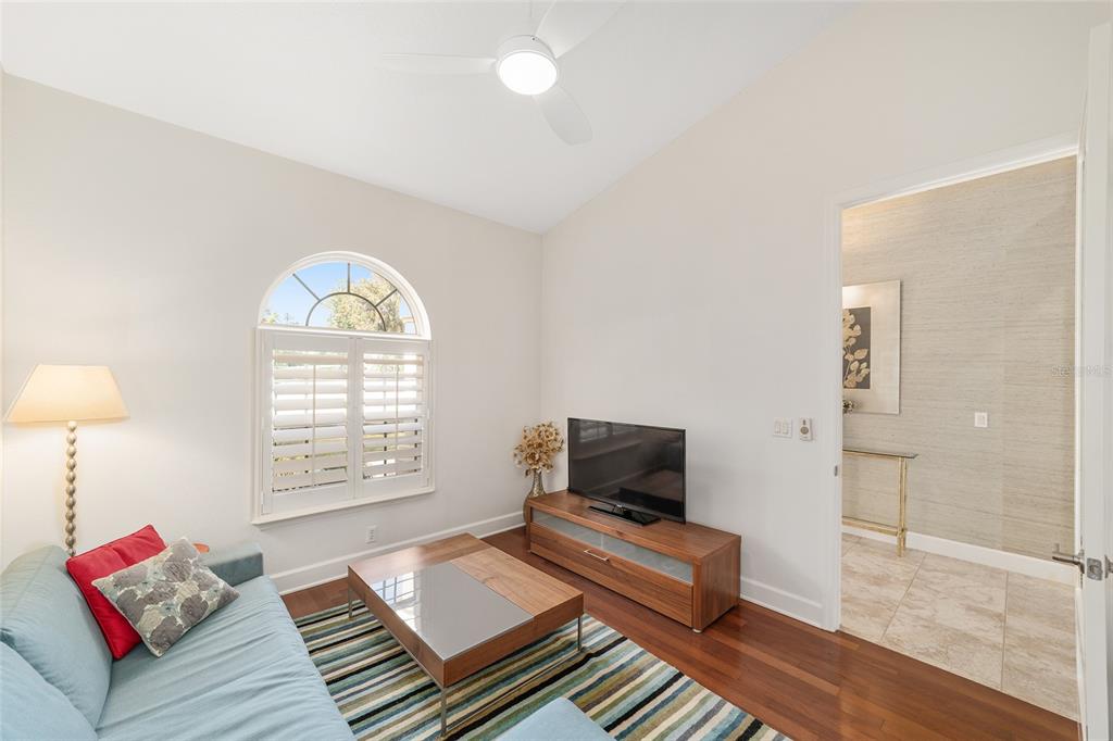 8942 Southwest 8th Street Ocala, FL 34481 - Photo 12 of 59 a living room with furniture and a window