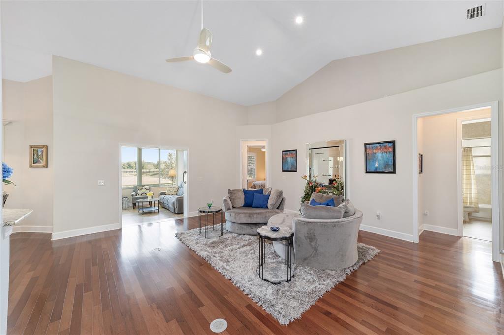 8942 Southwest 8th Street Ocala, FL 34481 - Photo 13 of 59 a living room with furniture and wooden floor