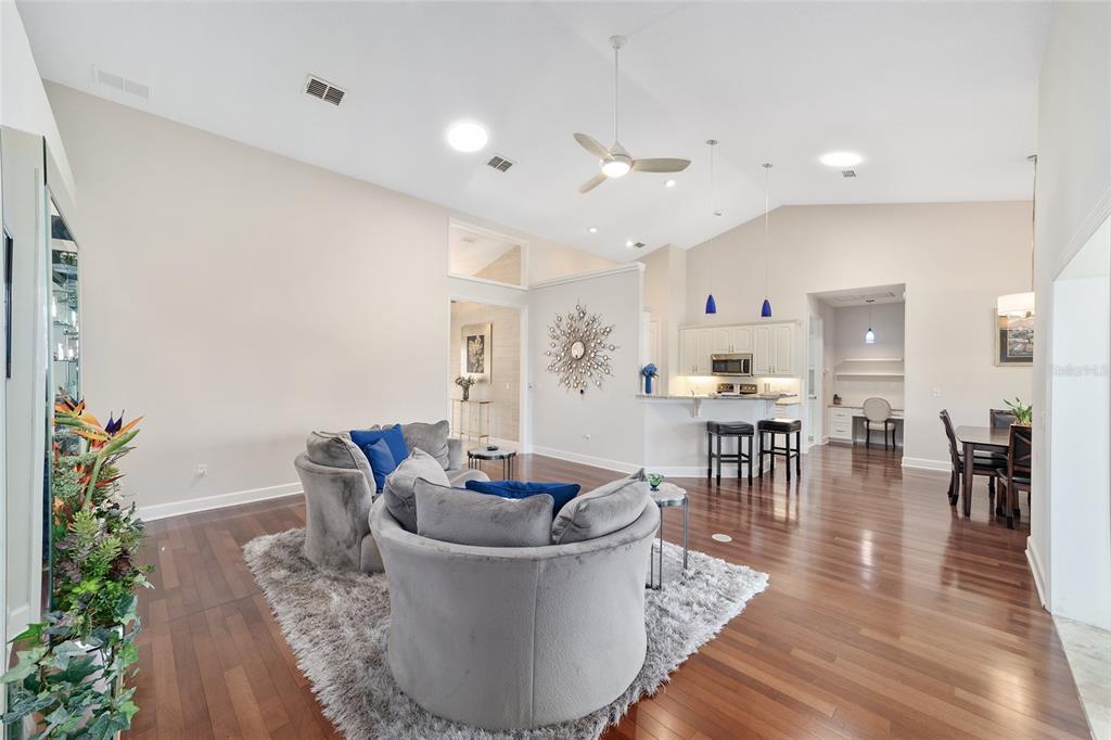 8942 Southwest 8th Street Ocala, FL 34481 - Photo 15 of 59 a living room with furniture and wooden floor