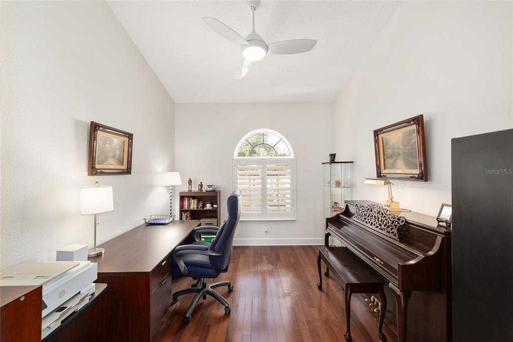 8942 Southwest 8th Street Ocala, FL 34481 - Photo 26 of 59 a view of a workspace with furniture and a window
