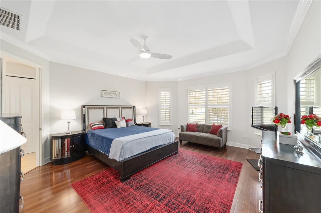 8942 Southwest 8th Street Ocala, FL 34481 - Photo 29 of 59 a bedroom with a bed a couch and dresser