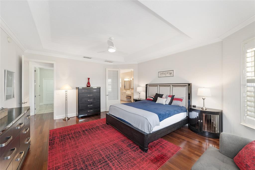 8942 Southwest 8th Street Ocala, FL 34481 - Photo 31 of 59 a bedroom with a bed and a dresser