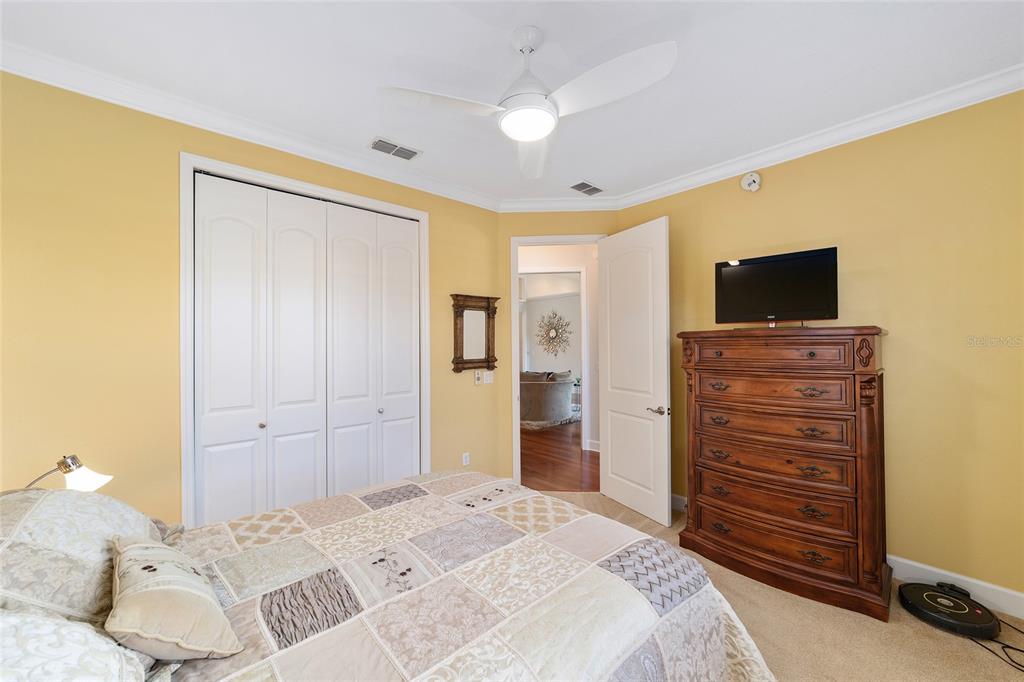 8942 Southwest 8th Street Ocala, FL 34481 - Photo 38 of 59 a bedroom with a bed and a flat screen tv