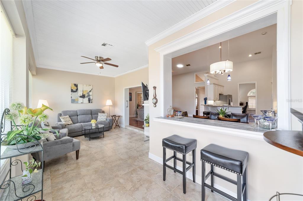 8942 Southwest 8th Street Ocala, FL 34481 - Photo 48 of 59 a living room with furniture and a chandelier