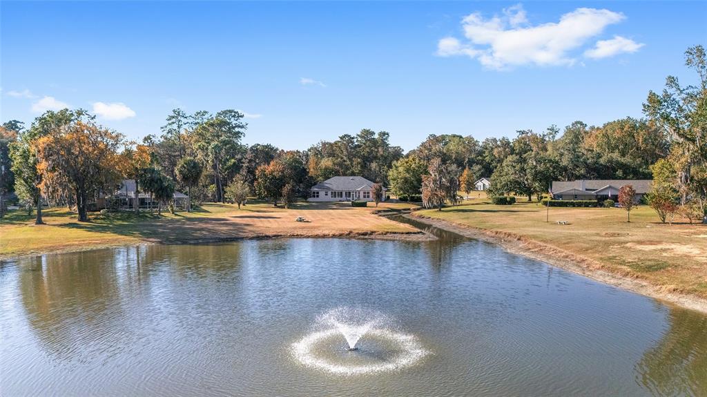 8942 Southwest 8th Street Ocala, FL 34481 - Photo 6 of 59 a view of a swimming pool with an outdoor space and seating area