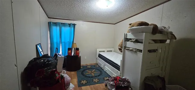 a bed room with a bed and a potted plant