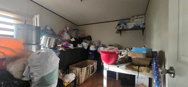 a bedroom with bed and a mirror