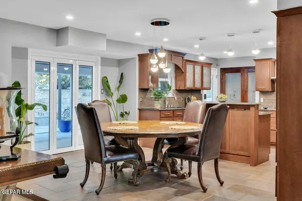 a kitchen with stainless steel appliances granite countertop a stove sink and cabinets