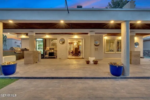 an aerial view of a house with yard swimming pool and outdoor seating