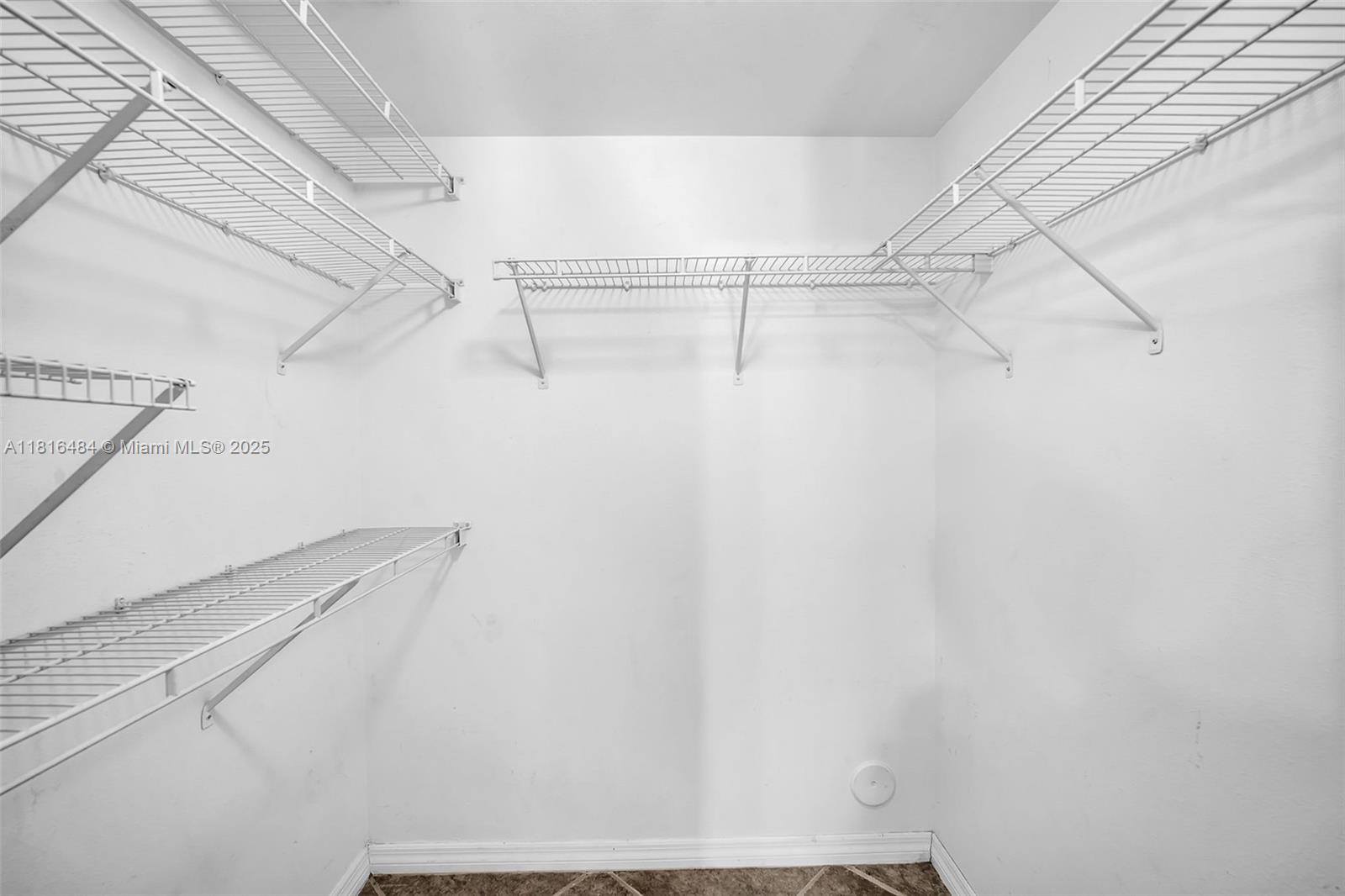 2474 Centergate Drive, Unit 101 Miramar, FL 33025 - Photo 14 of 28 a view of a room with racks on the wall