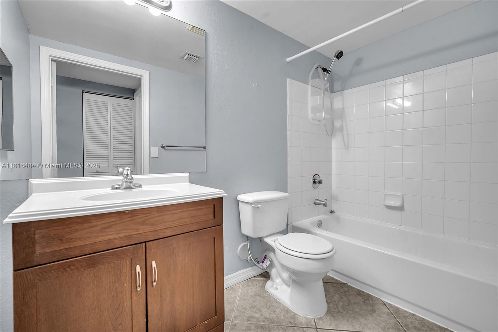 2474 Centergate Drive, Unit 101 Miramar, FL 33025 - Photo 15 of 28 a bathroom with a sink toilet and shower