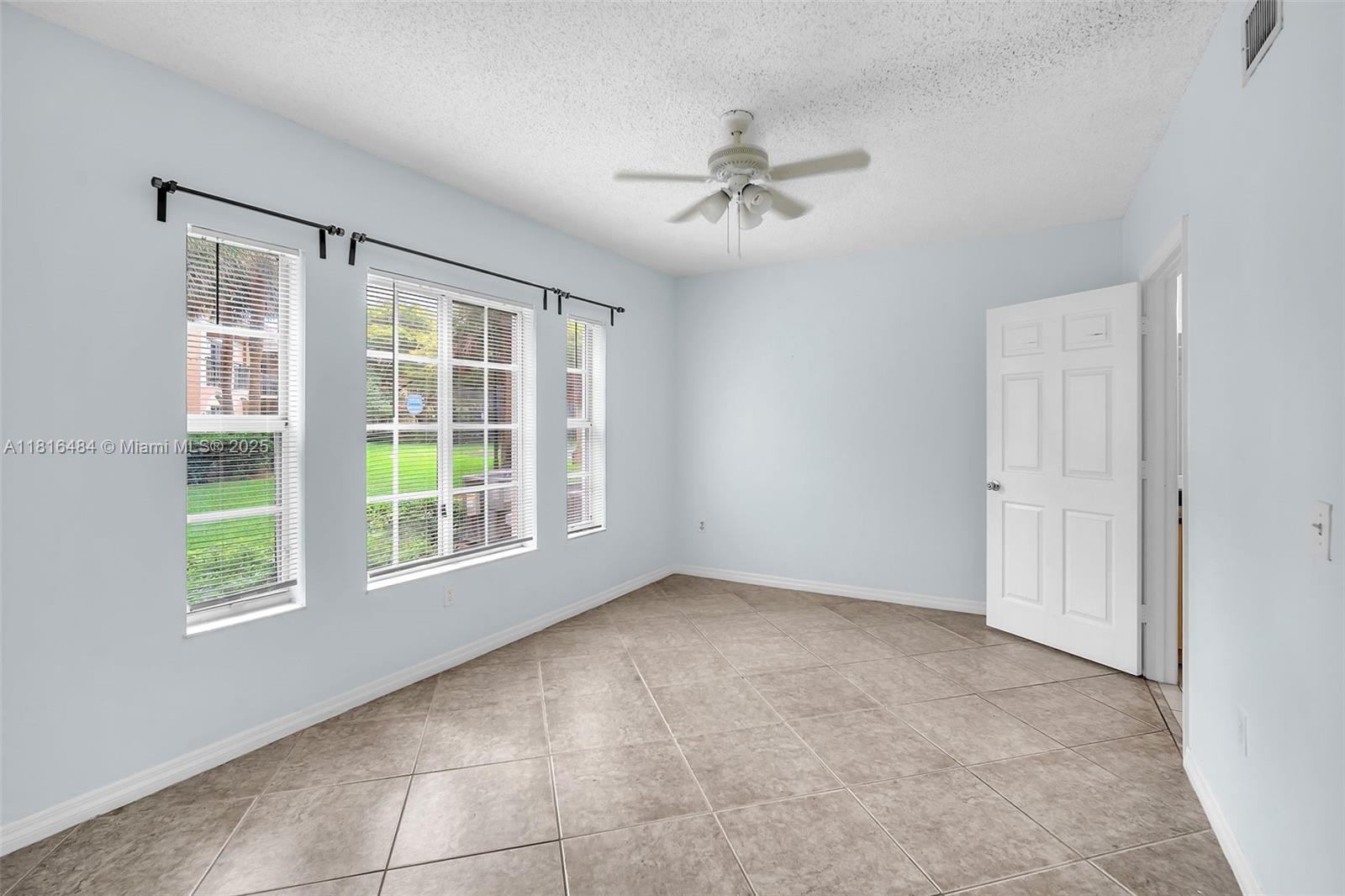 2474 Centergate Drive, Unit 101 Miramar, FL 33025 - Photo 19 of 28 a view of an empty room with a window