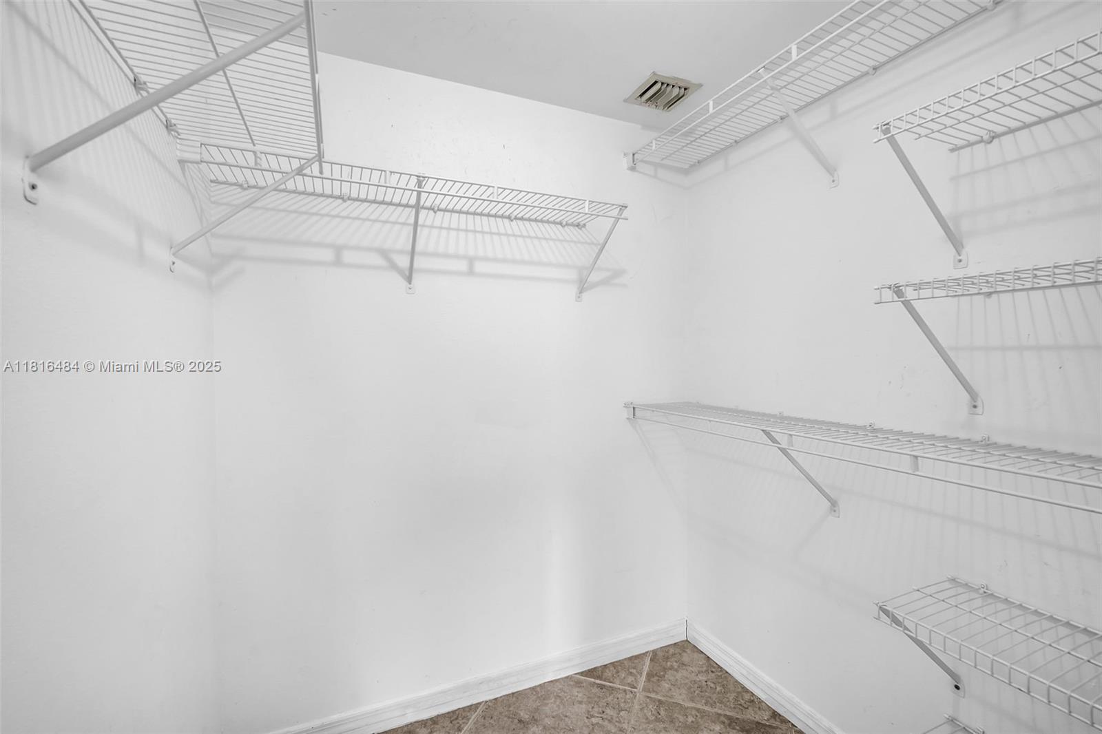 2474 Centergate Drive, Unit 101 Miramar, FL 33025 - Photo 20 of 28 a view of a room with racks on the wall