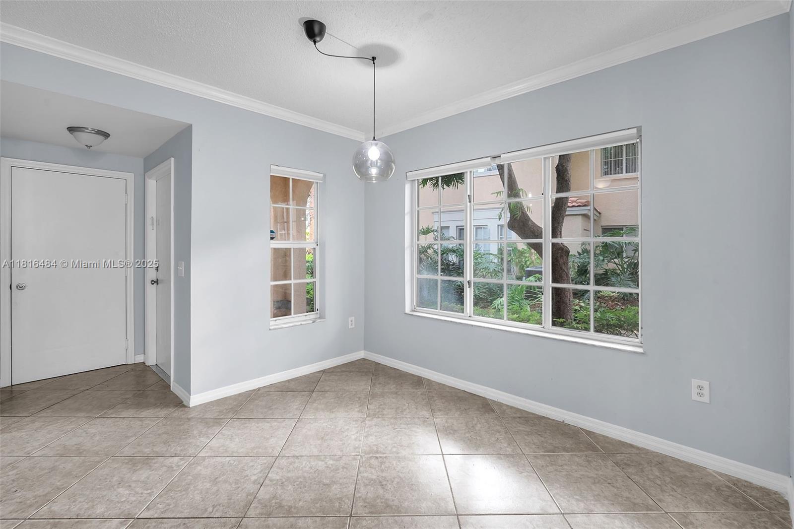 2474 Centergate Drive, Unit 101 Miramar, FL 33025 - Photo 2 of 28 a view of an empty room with a window