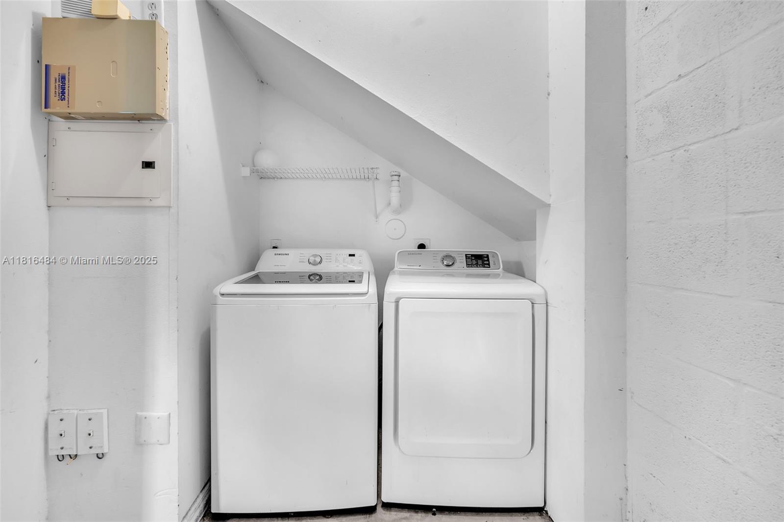 2474 Centergate Drive, Unit 101 Miramar, FL 33025 - Photo 21 of 28 a utility room with dryer and washer