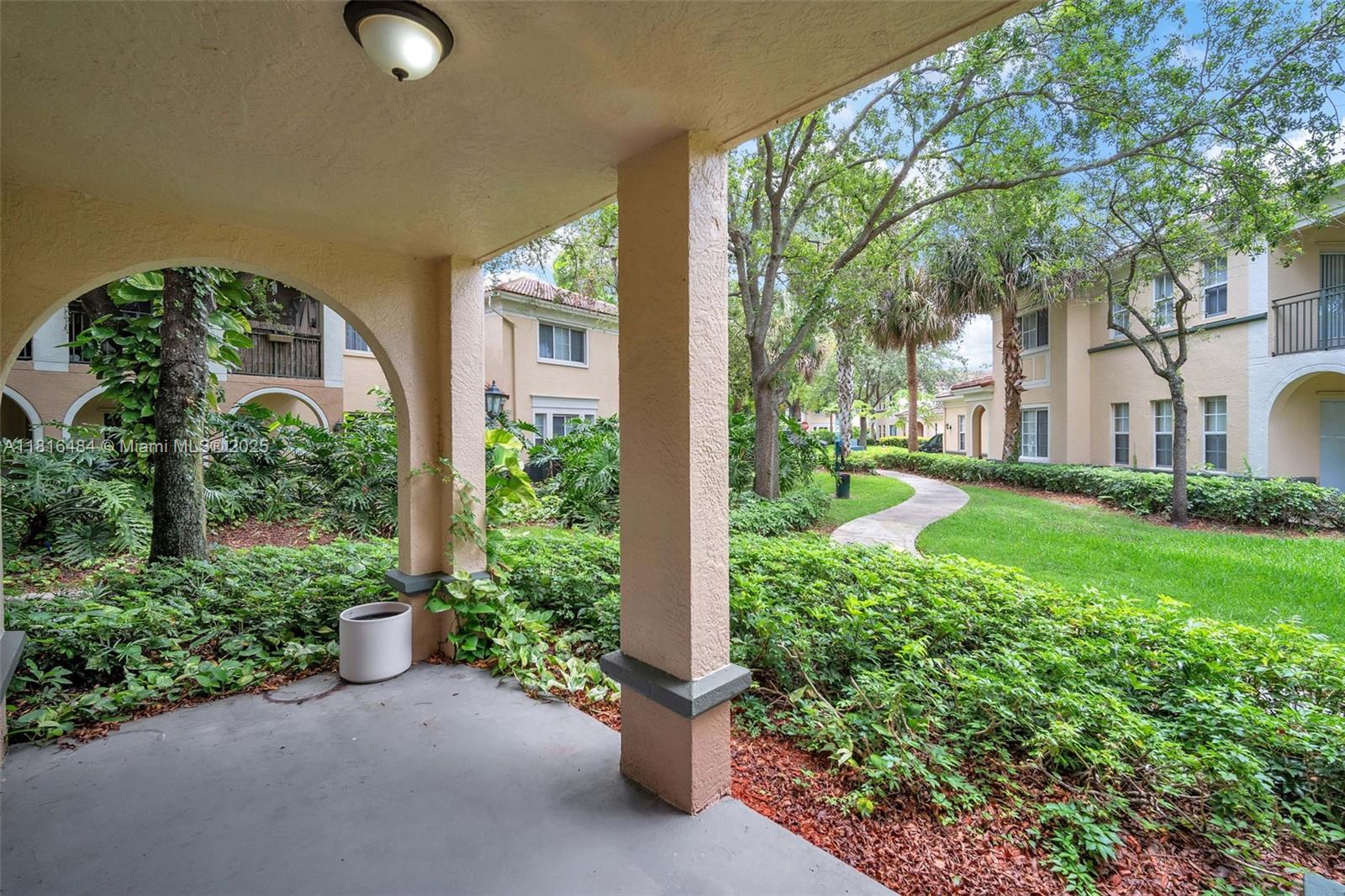2474 Centergate Drive, Unit 101 Miramar, FL 33025 - Photo 22 of 28 front view of a house with a yard